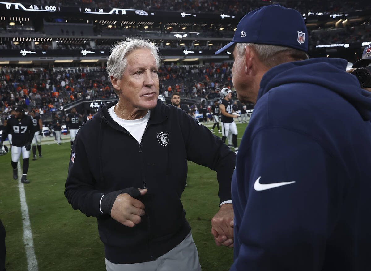 Raiders head coach Pete Carroll greets Denver Broncos head coach Sean Payton following their NF ...