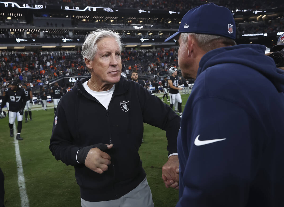 Raiders head coach Pete Carroll greets Denver Broncos head coach Sean Payton following their NF ...
