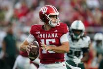 Indiana quarterback Fernando Mendoza (15) looks to pass during an NCAA football game against Mi ...