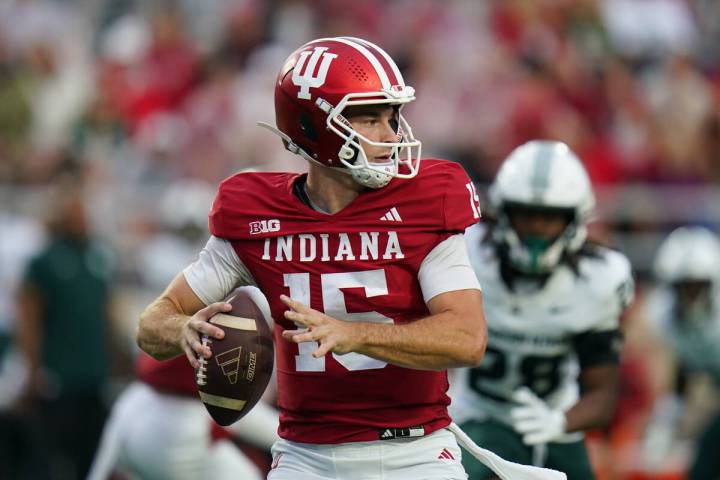 Indiana quarterback Fernando Mendoza (15) looks to pass during an NCAA football game against Mi ...