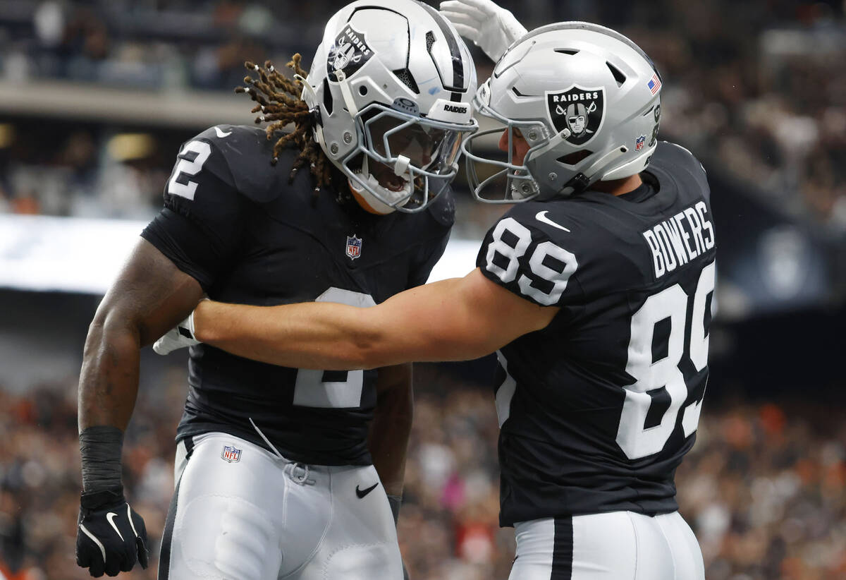 Raiders tight end Brock Bowers (89) celebrates his touchdown with running back Ashton Jeanty (2 ...