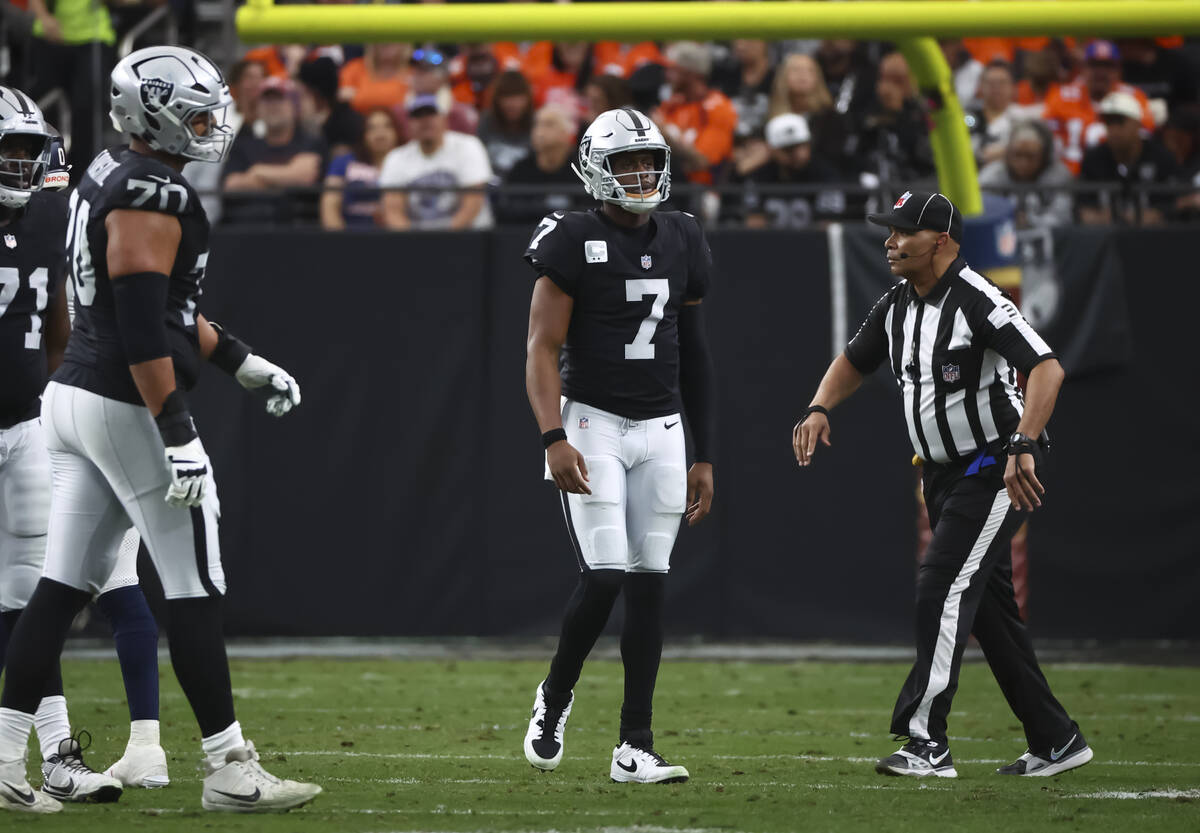 Raiders quarterback Geno Smith (7) walks off the field after getting sacked during the first ha ...