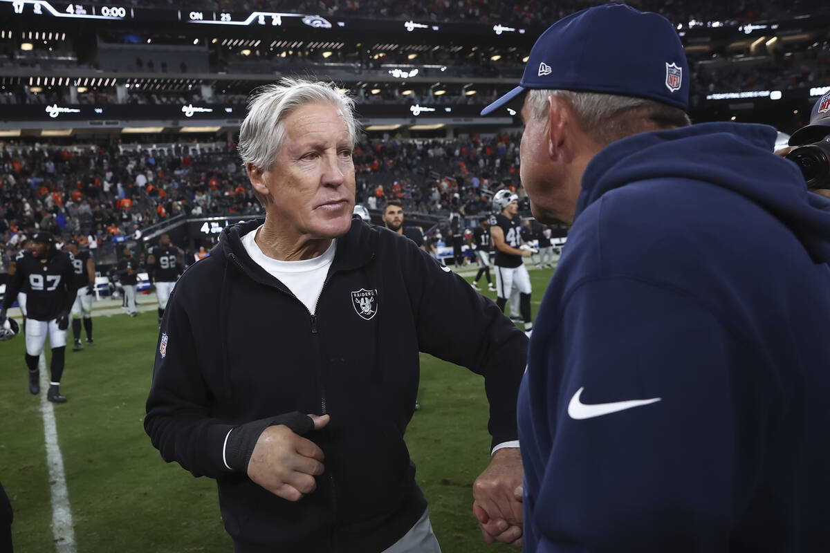 Raiders head coach Pete Carroll greets Denver Broncos head coach Sean Payton following their NF ...