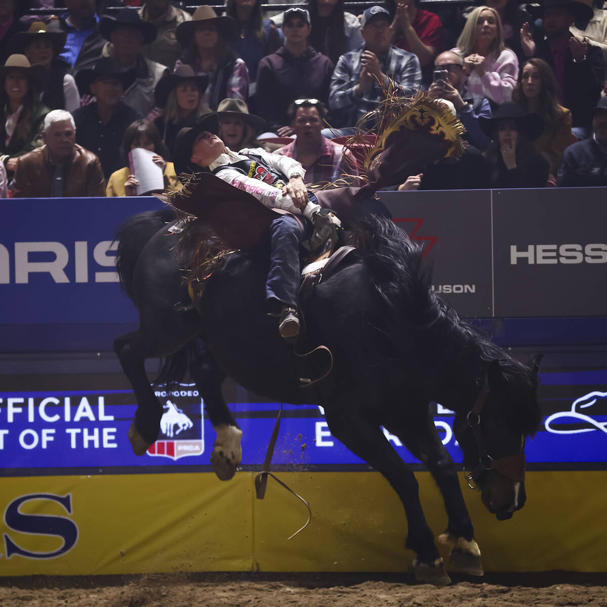 Wacey Schalla rides Breaking News while competing in bareback riding during the fifth go-round ...