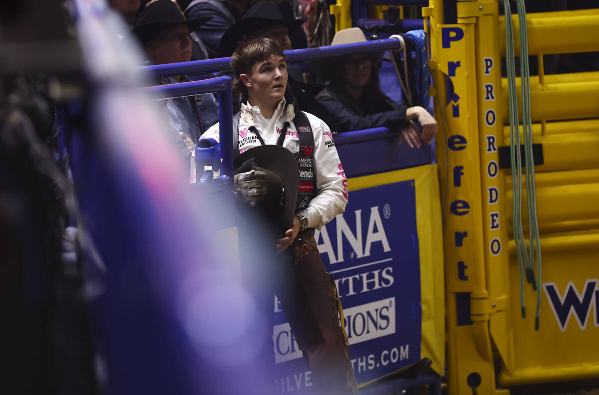Wacey Schalla looks on after competing in bareback riding during the fifth go-round of the Nati ...