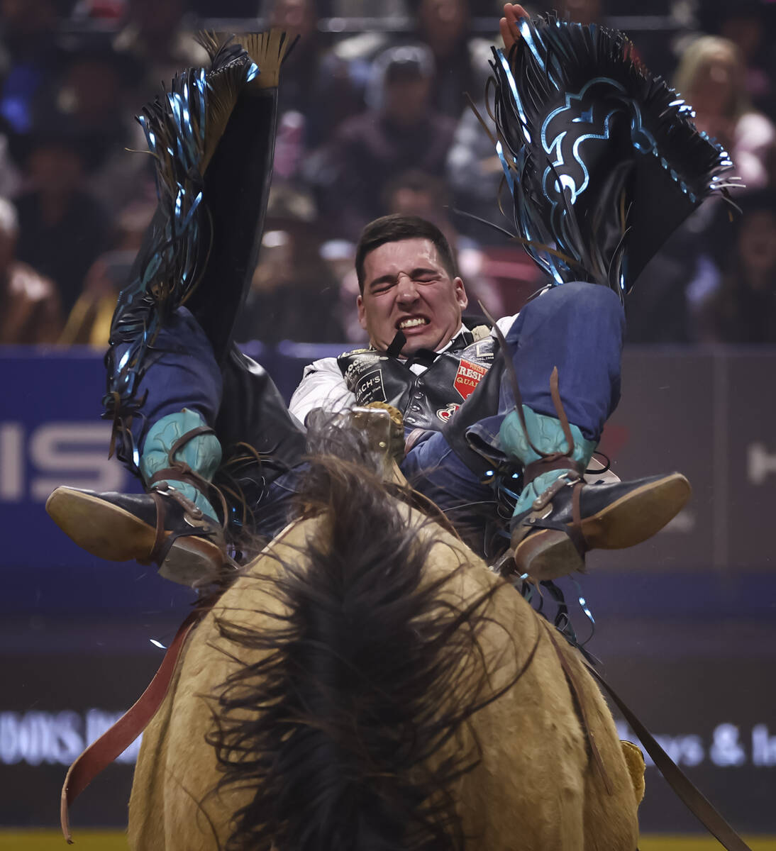 Jess Pope rides Gun Fire while competing in bareback riding during the fifth go-round of the Na ...