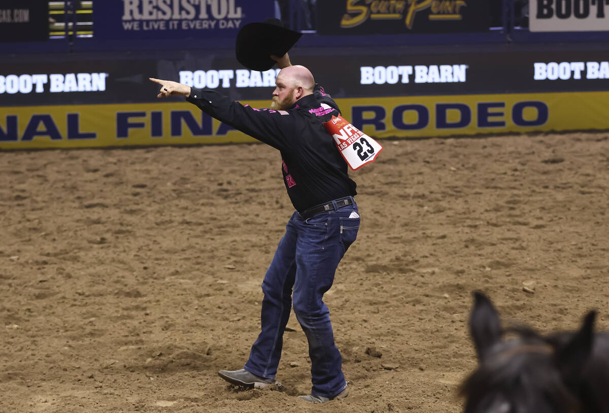 Will Lummus reacts after competing in steer wrestling during the fifth go-round of the National ...