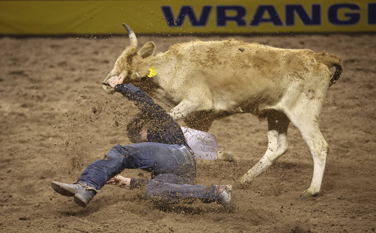 Tyler Waguespack comes up short in steer wrestling during the fifth go-round of the National Fi ...