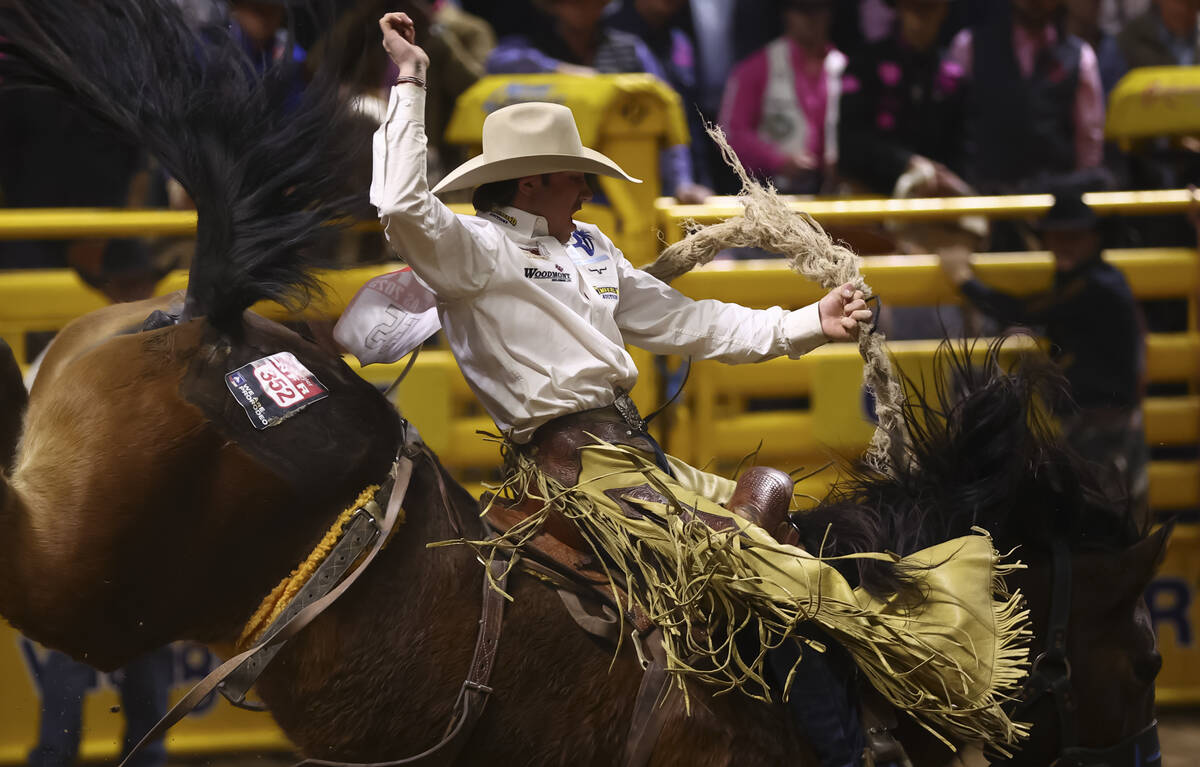 Q Taylor rides Straight Moonshine while competing in saddle bronc riding during the fifth go-ro ...