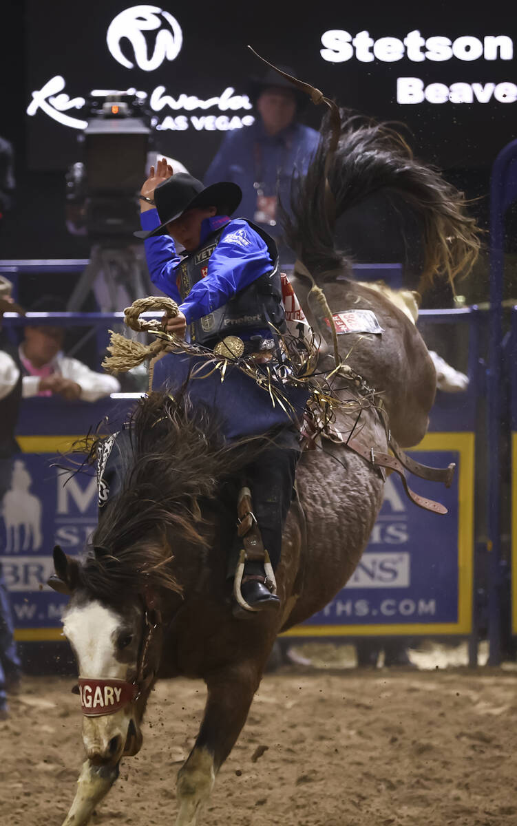 Stetson Wright rides Dandy Delight while competing in saddle bronc riding during the fifth go-r ...