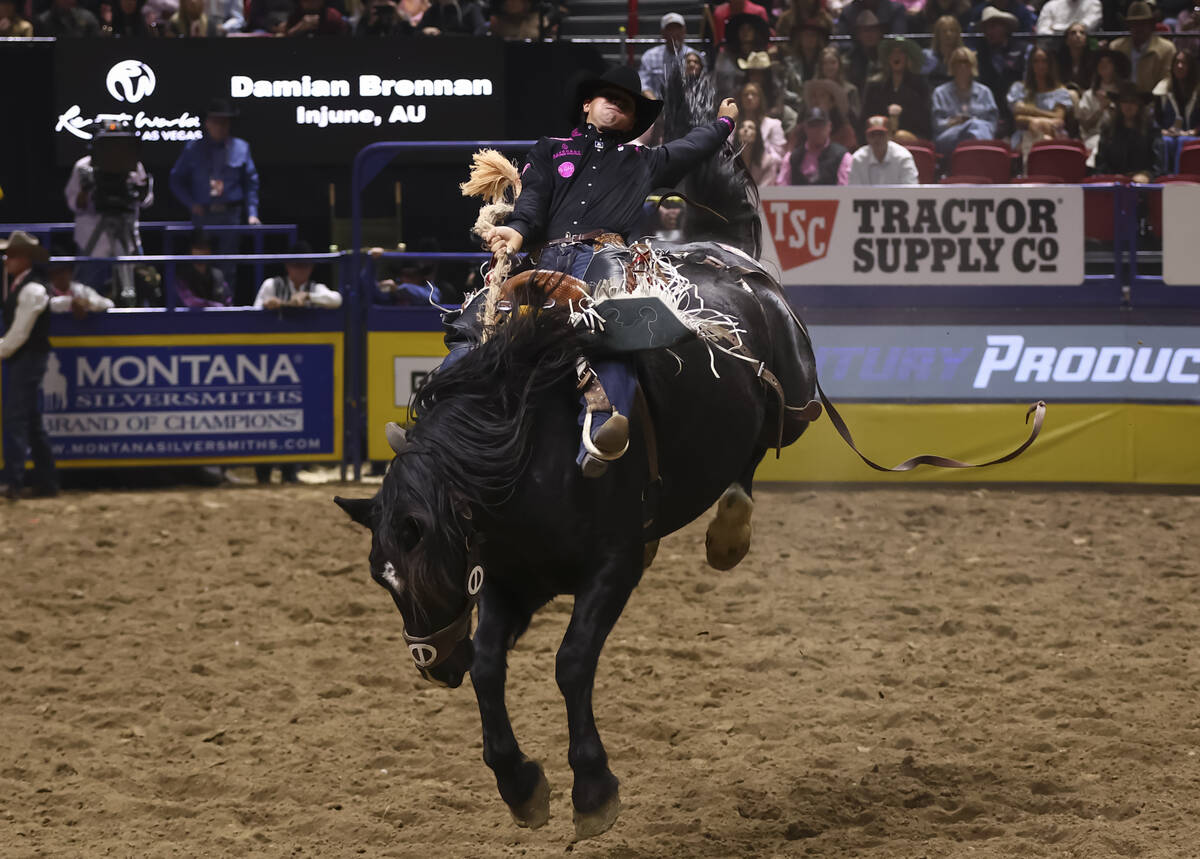 Damian Brennan rides R. Watsons Ed Bishop while competing in saddle bronc riding during the fif ...