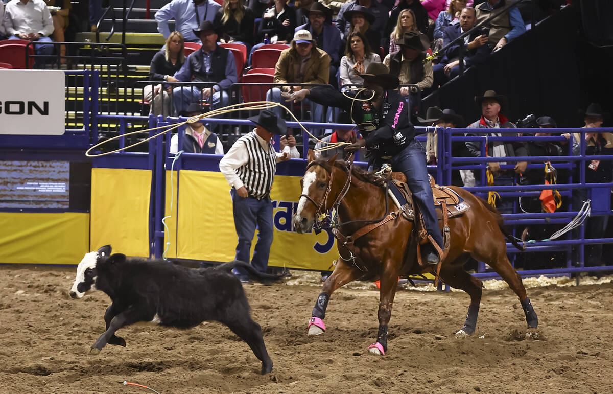 John Douch competes in tie-down roping during the fifth go-round of the National Finals Rodeo a ...