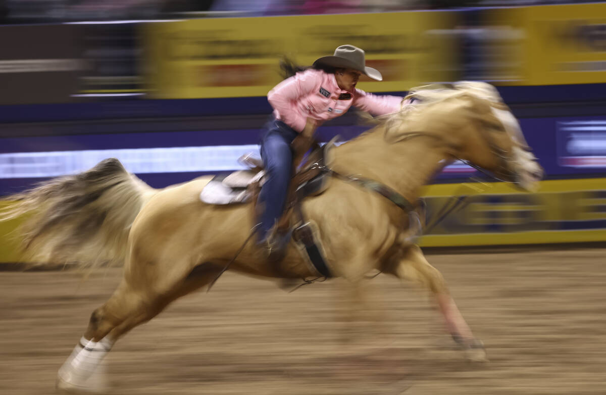 Hailey Kinsel competes in barrel racing during the fifth go-round of the National Finals Rodeo ...