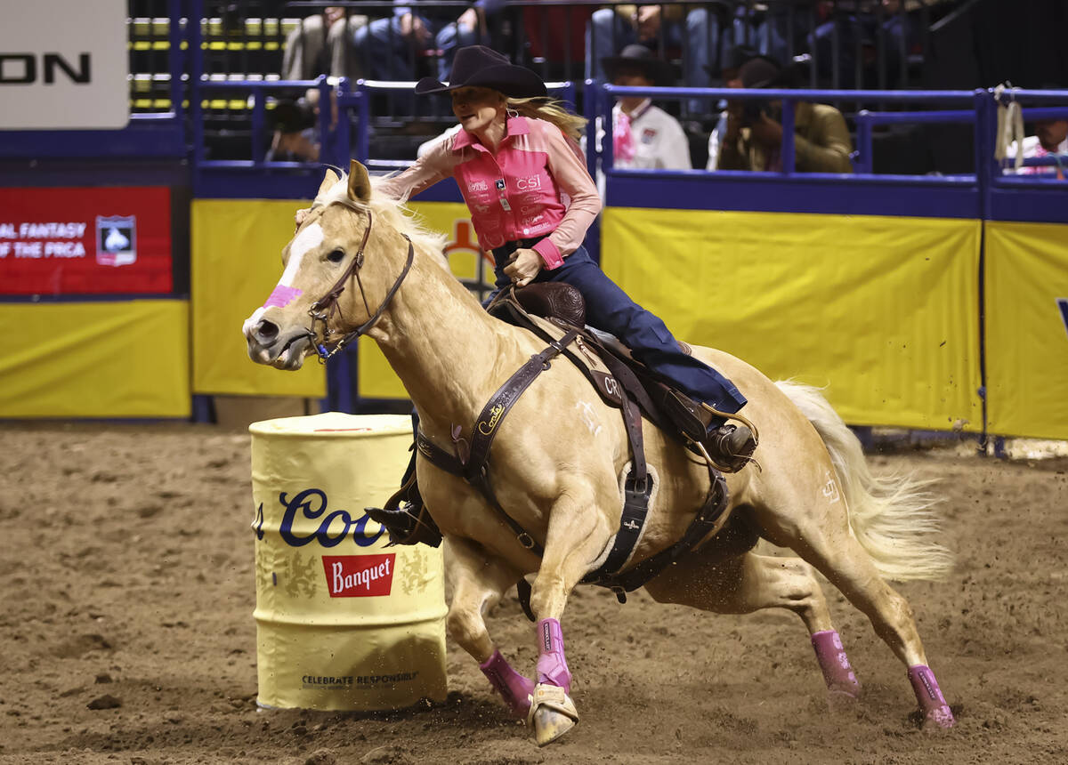 Carlee Otero competes in barrel racing during the fifth go-round of the National Finals Rodeo a ...