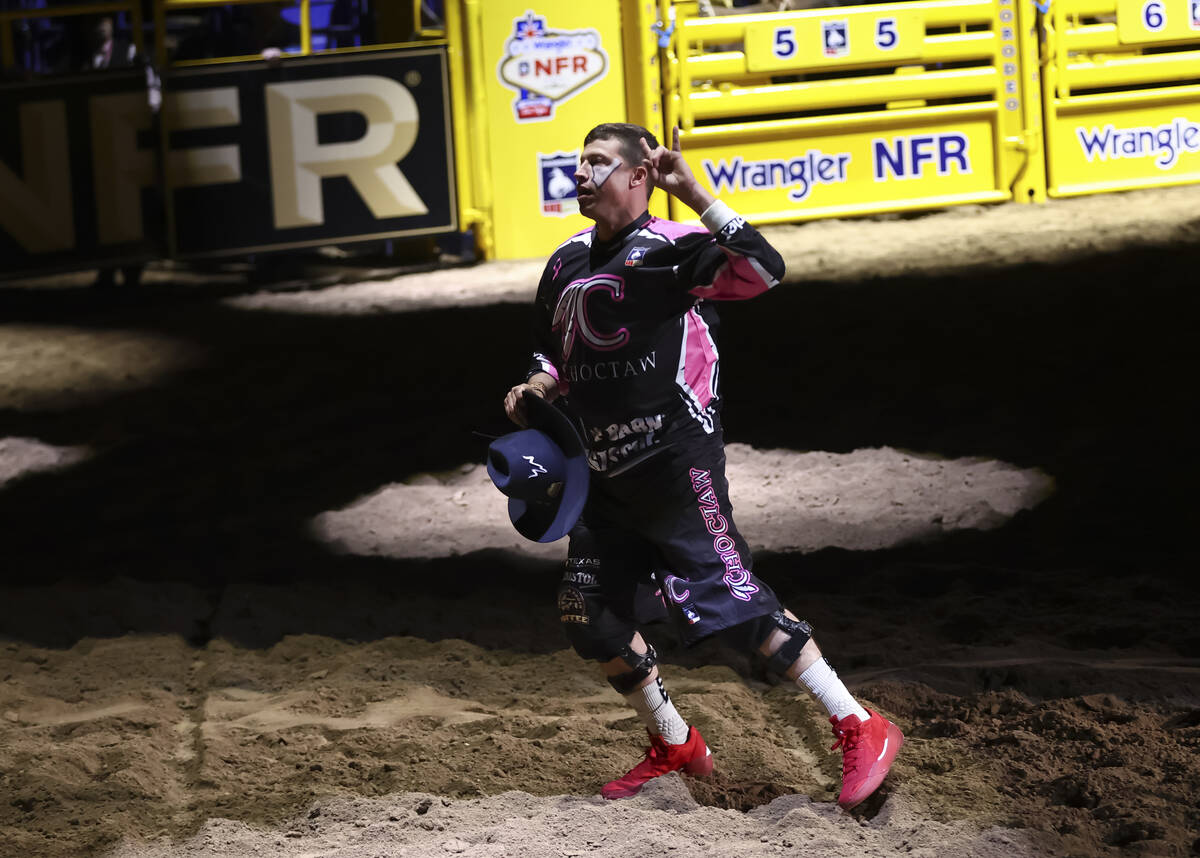 Bullfighter Cody Webster is introduced during the fifth go-round of the National Finals Rodeo a ...