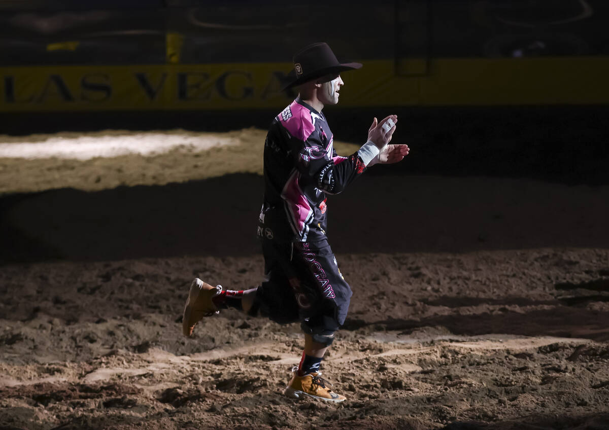 Bullfighter Dusty Tuckness is introduced during the fifth go-round of the National Finals Rodeo ...
