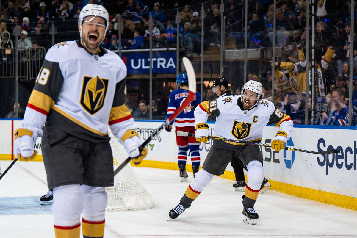 Vegas Golden Knights center Tomas Hertl (48) and right wing Mark Stone (61) celebrate scoring a ...