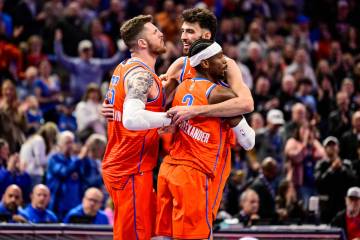 Oklahoma City Thunder center/forward Chet Holmgren (7), center, celebrates with Oklahoma City T ...
