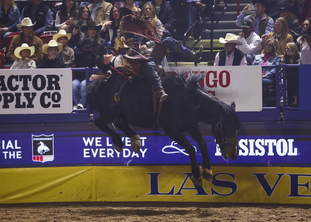 Wacey Schalla rides Breaking News while competing in bareback riding during the fifth go-round ...