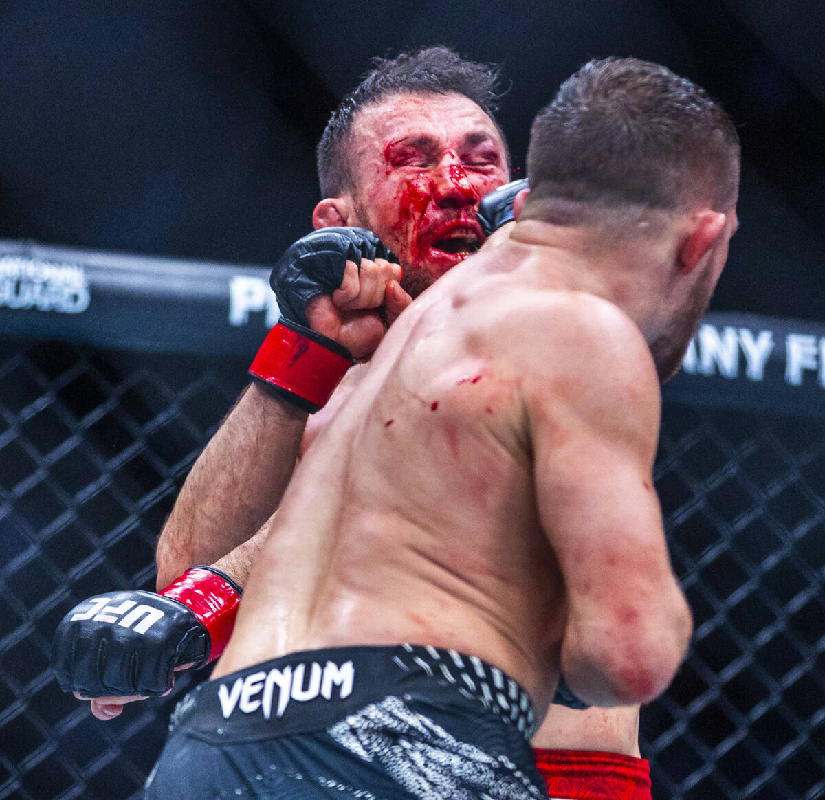 Petr Yan connects with a punch to the face of Merab Dvalishvili during their bantamweight title ...