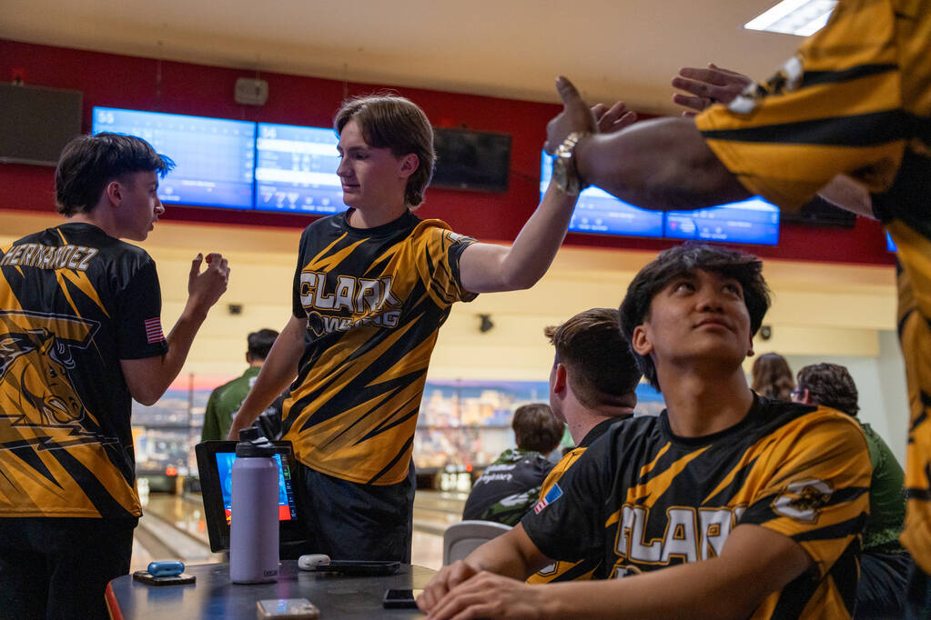 Clark’s Ryland Gregorich is congratulated by his teammates after playing his turn during ...