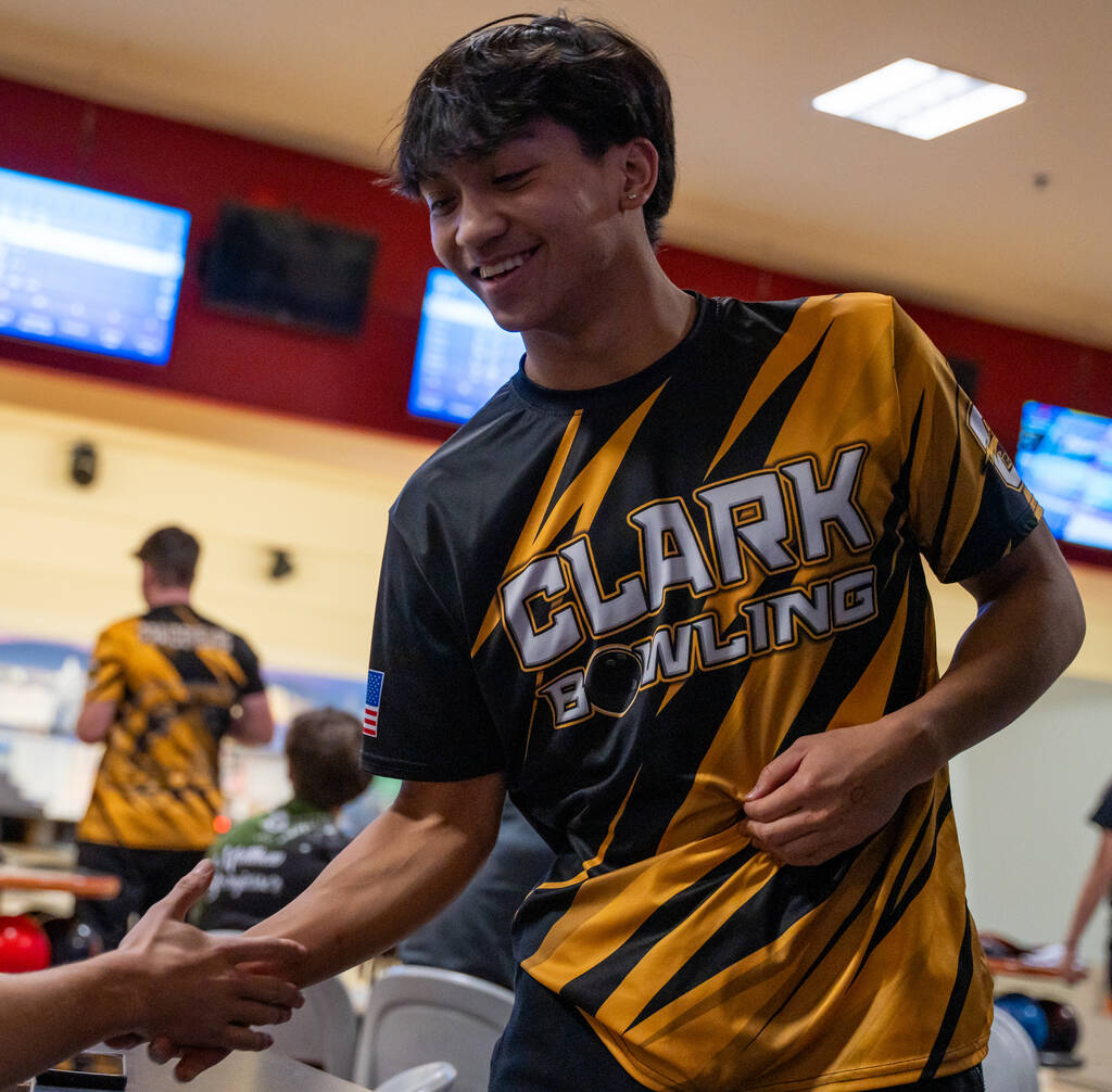 Clark’s Calvin Lee is congratulated by his teammates during a 5A bowling match against P ...
