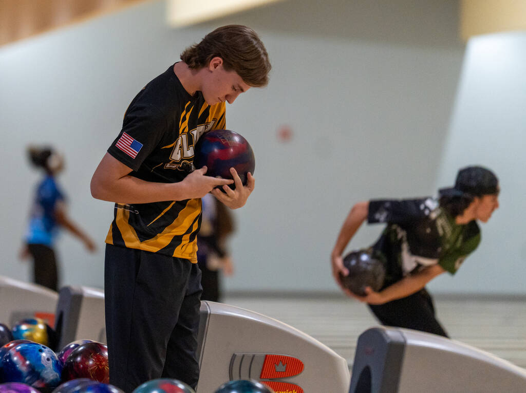 Clark’s Ryland Gregorich adjusts his grip before playing his turn during a 5A bowling ma ...