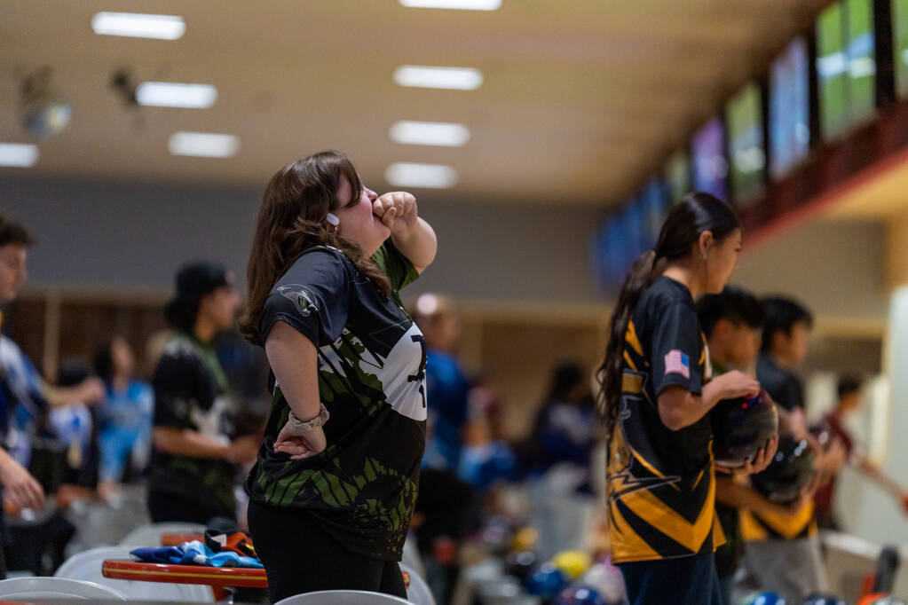 Clark’s Caitlyn Bixenmann waits for her score to appear during a 5A bowling match agains ...