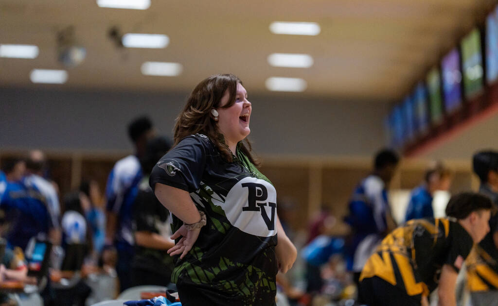 Clark’s Caitlyn Bixenmann reacts after seeing her score during a 5A bowling match agains ...