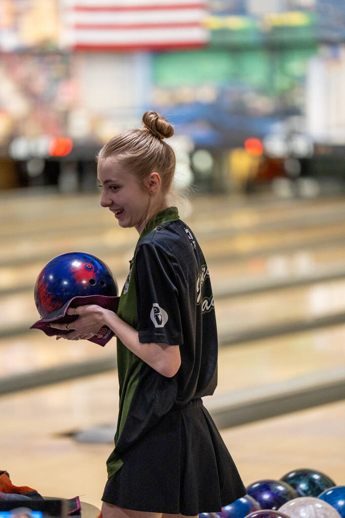 Palo Verde’s Jessica Read chats with her teammates before playing her turn during a 5A b ...