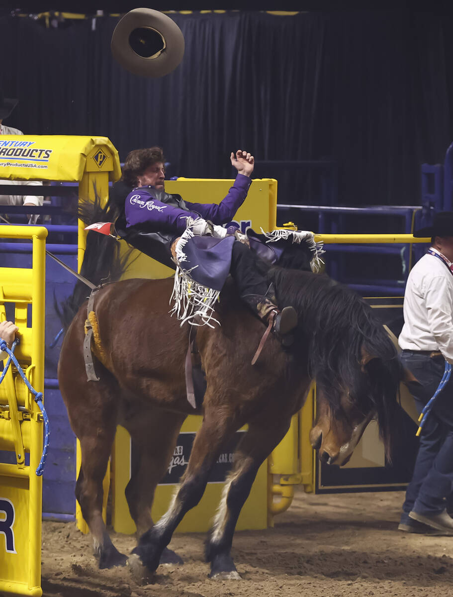Tilden Hooper rides Straight Stick while competing in bareback riding during the fifth go-round ...