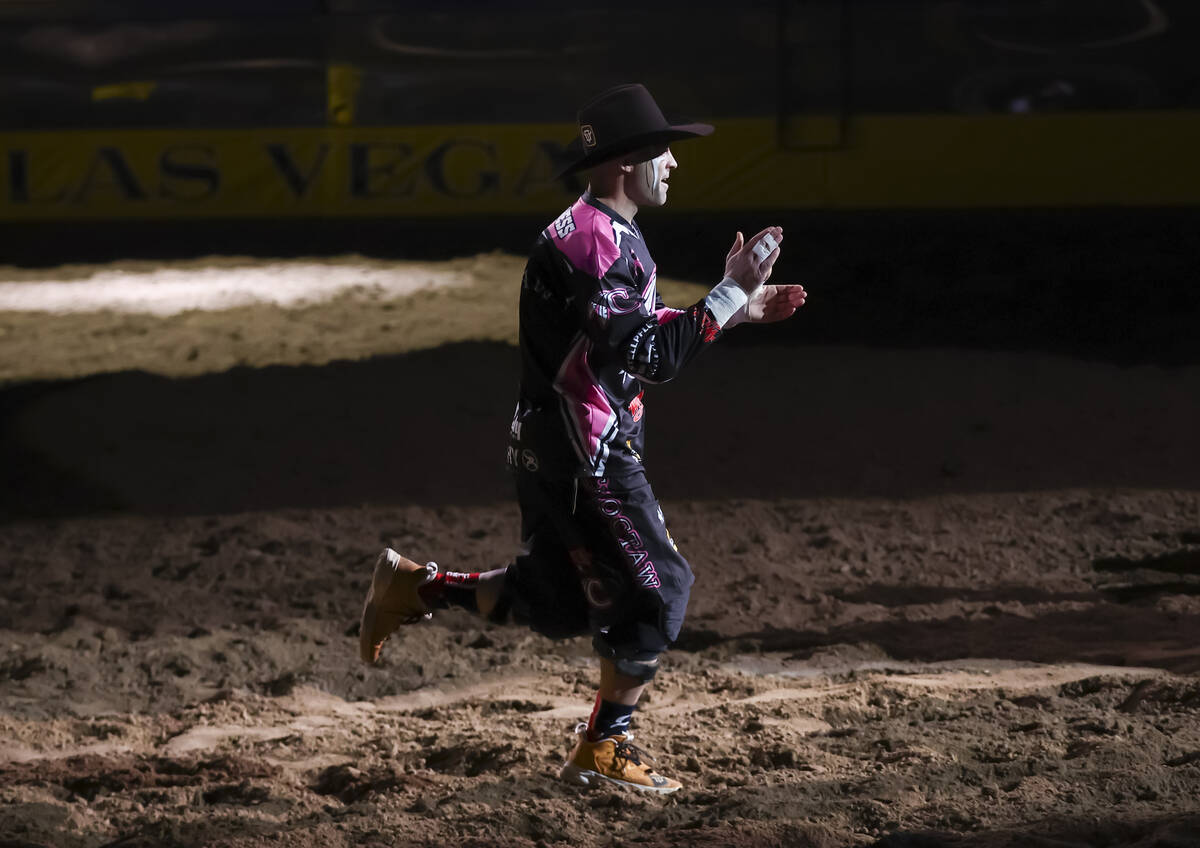 Bullfighter Dusty Tuckness is introduced during the fifth go-round of the National Finals Rodeo ...