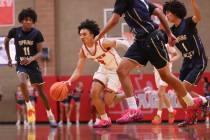 Arbor View guard Jaedon Johnson (3) brings the ball up court against Spring Valley during the f ...