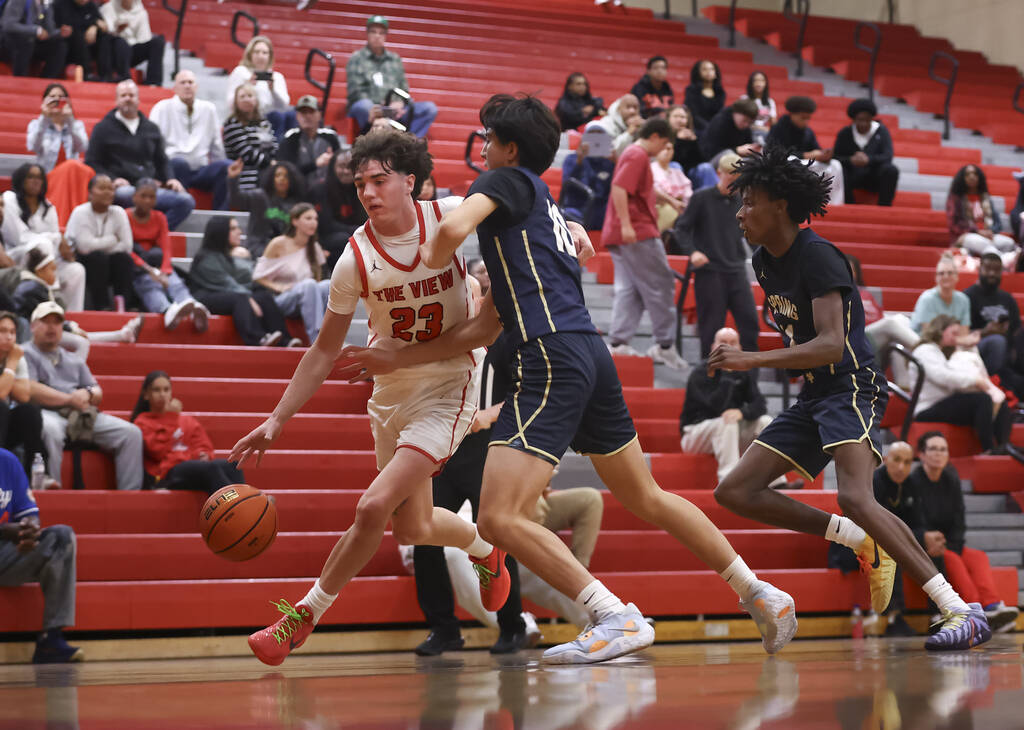 Arbor View guard Thaddeus Thatcher (23) drives to the basket against Spring Valley forward Nath ...