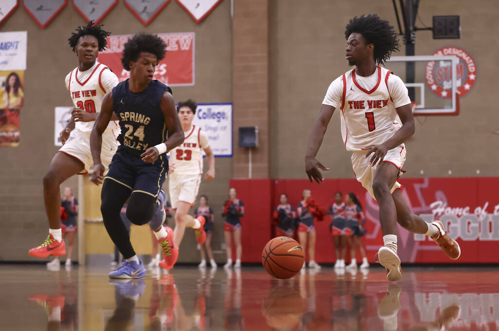 Arbor View guard Elijah Pierce (1) brings the ball up court against Spring Valley guard Dwayne ...