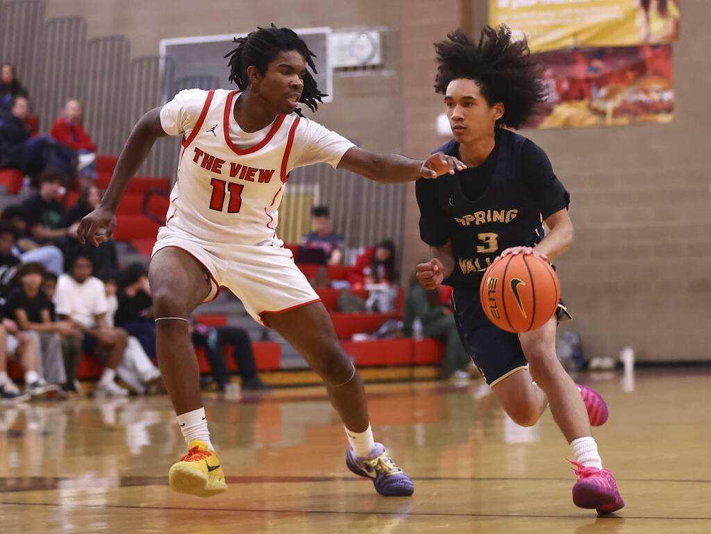 Spring Valley guard James Carson (3) drives to the basket against Arbor View forward Robert Mal ...