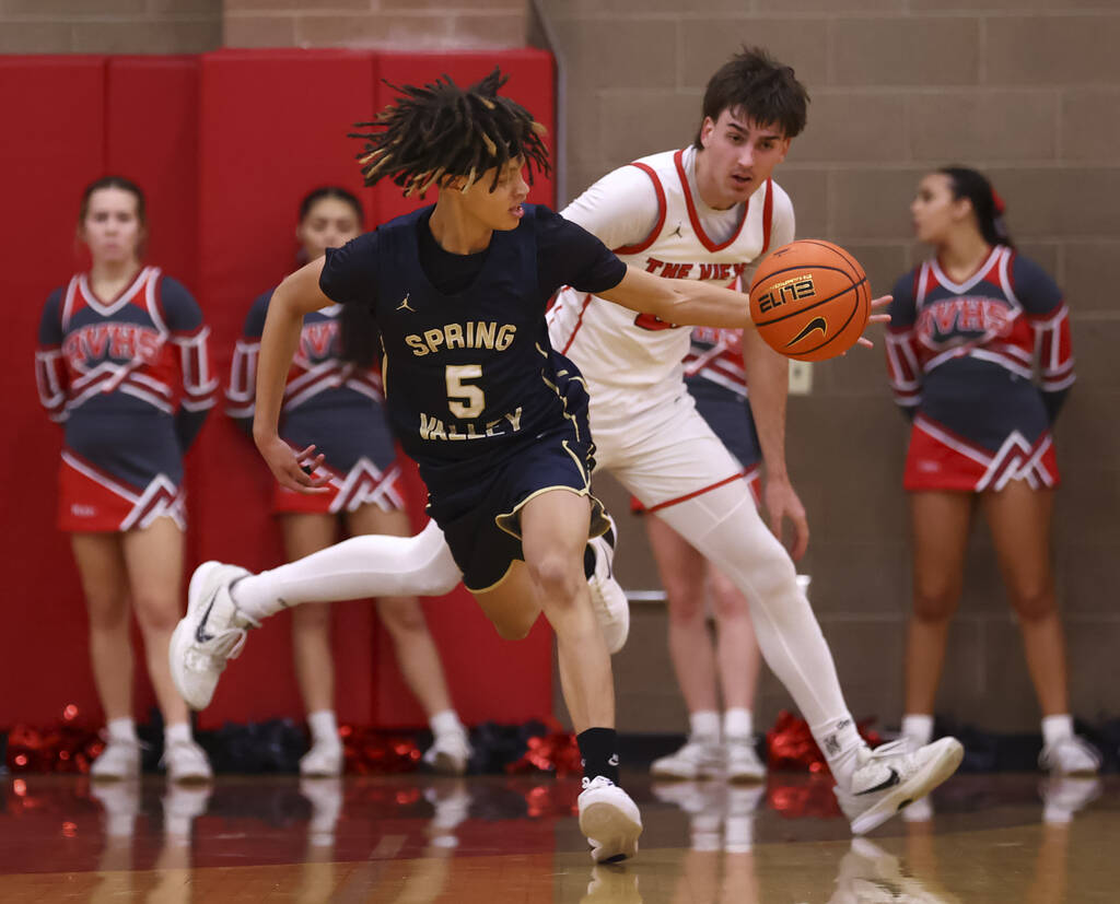 Spring Valley guard Azea Melo-Powell (5) grabs the ball in front of Arbor View forward Rylan He ...