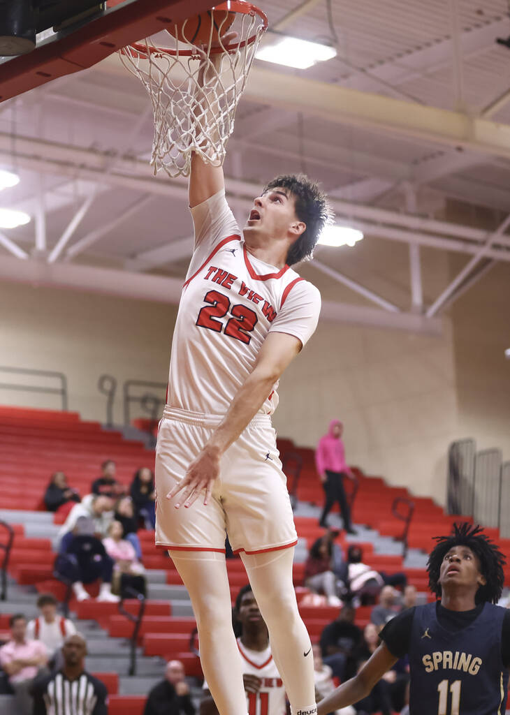 Arbor View forward Rylan Hearns (22) goes to the basket against Spring Valley during the first ...
