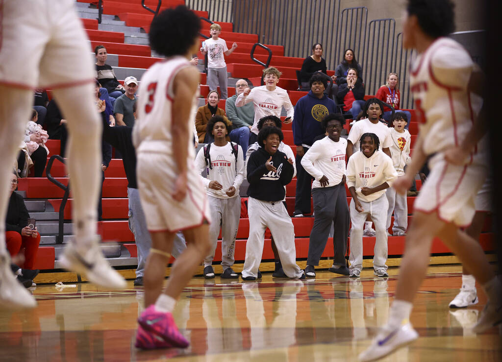 Arbor View fans celebrate as the team defeats Spring Valley to win a basketball game at Arbor V ...