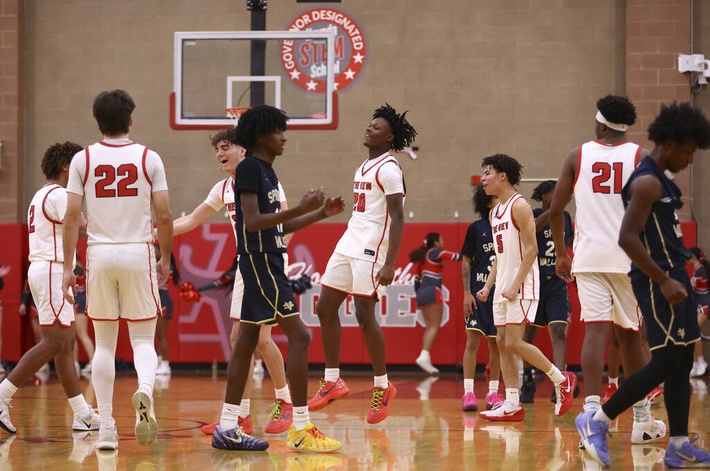 Arbor View players celebrate as they defeat Spring Valley to win a basketball game at Arbor Vie ...