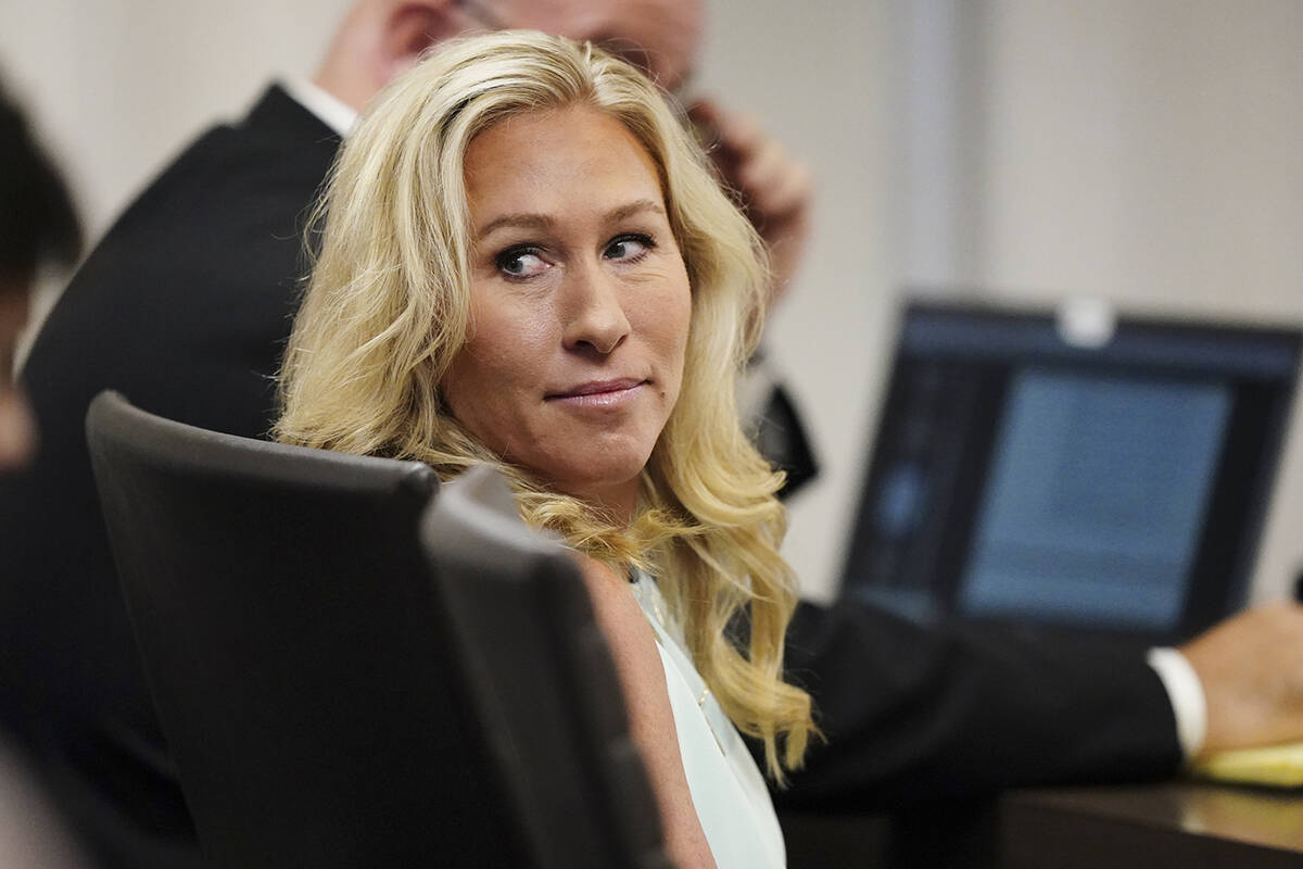 In this file photo, U.S. Rep. Marjorie Taylor Greene sits in the courtroom, April 22, 2022, in ...