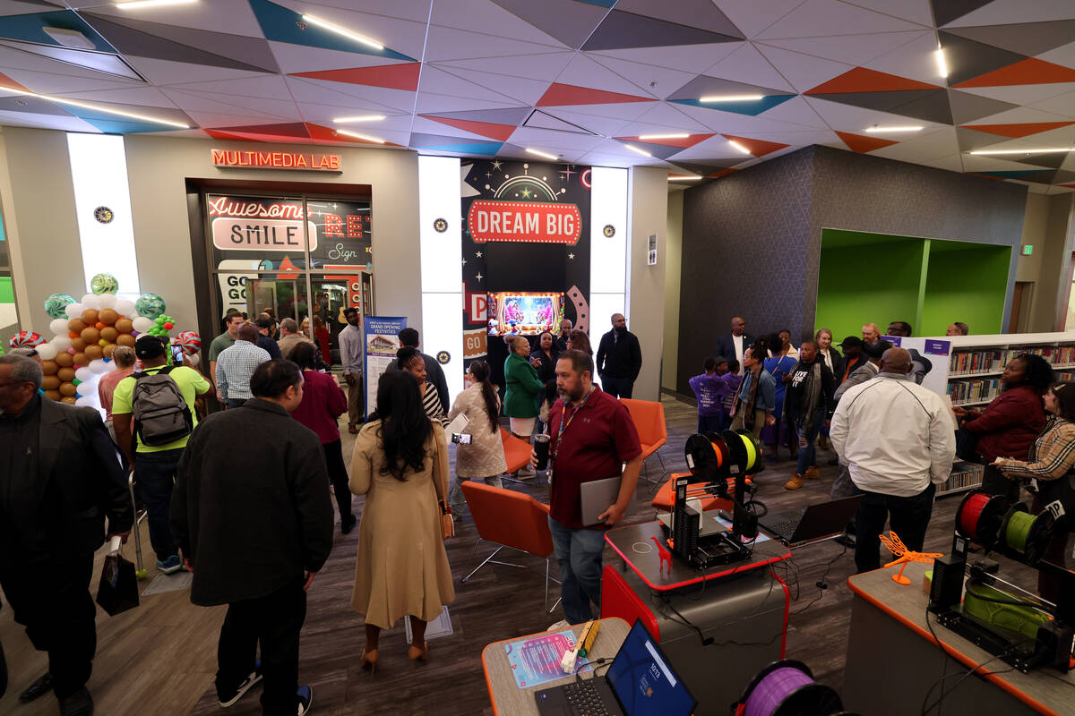Guests mingle during the grand opening of the new West Las Vegas Library at 1861 Martin Luther ...