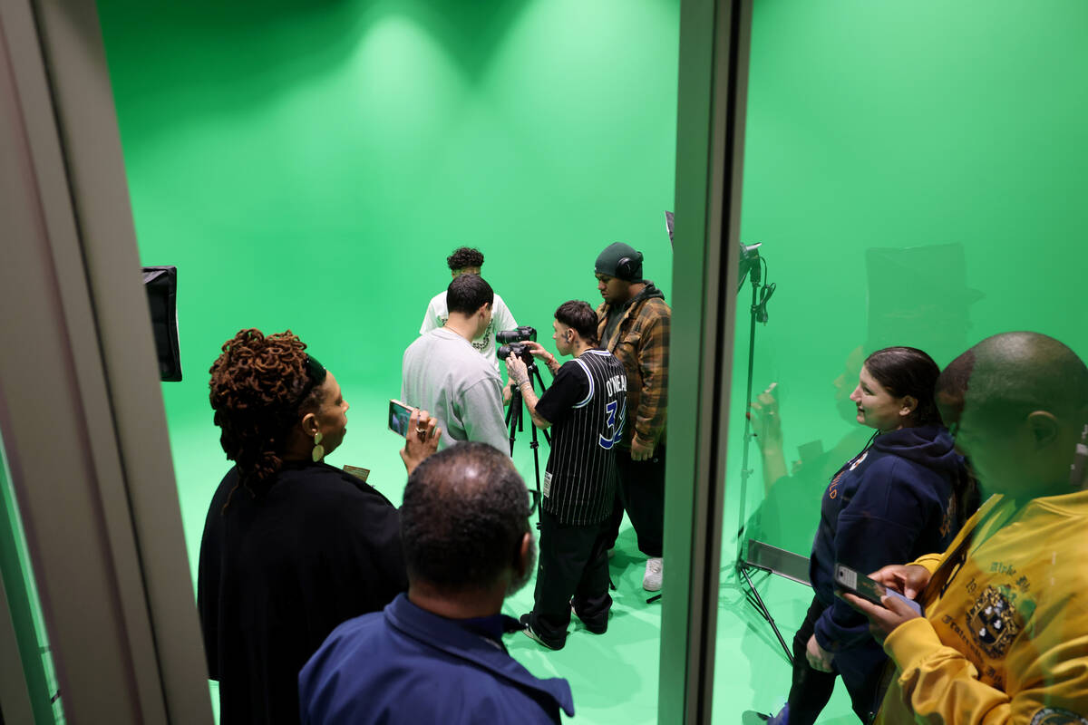 Guests check out the green screen room during the grand opening of the new West Las Vegas Libra ...