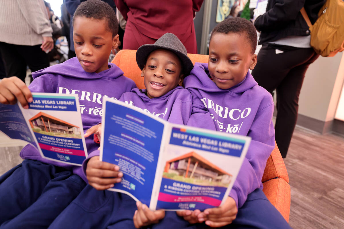 Brothers, from left, Diez, Dyver and Dior Derrico read the program during the grand opening of ...