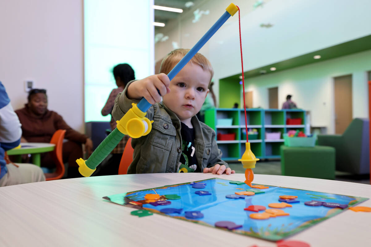Chase Watts, 2, plays during the grand opening of the new West Las Vegas Library at 1861 Martin ...