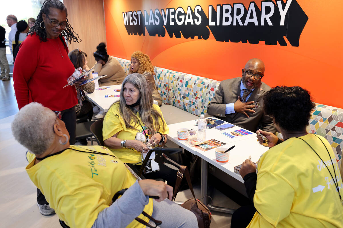 Guests mingle during the grand opening of the new West Las Vegas Library at 1861 Martin Luther ...