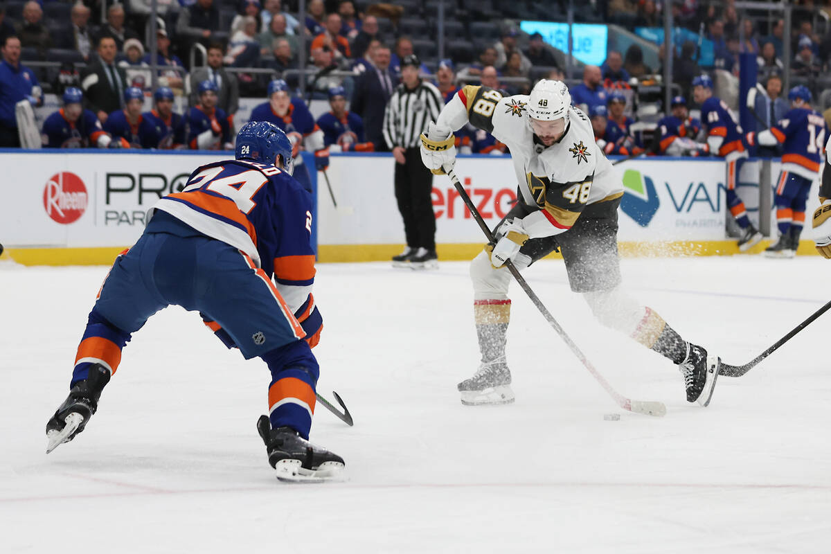 Vegas Golden Knights' Tomas Hertl (48) takes a shot past New York Islanders' Scott Ma ...