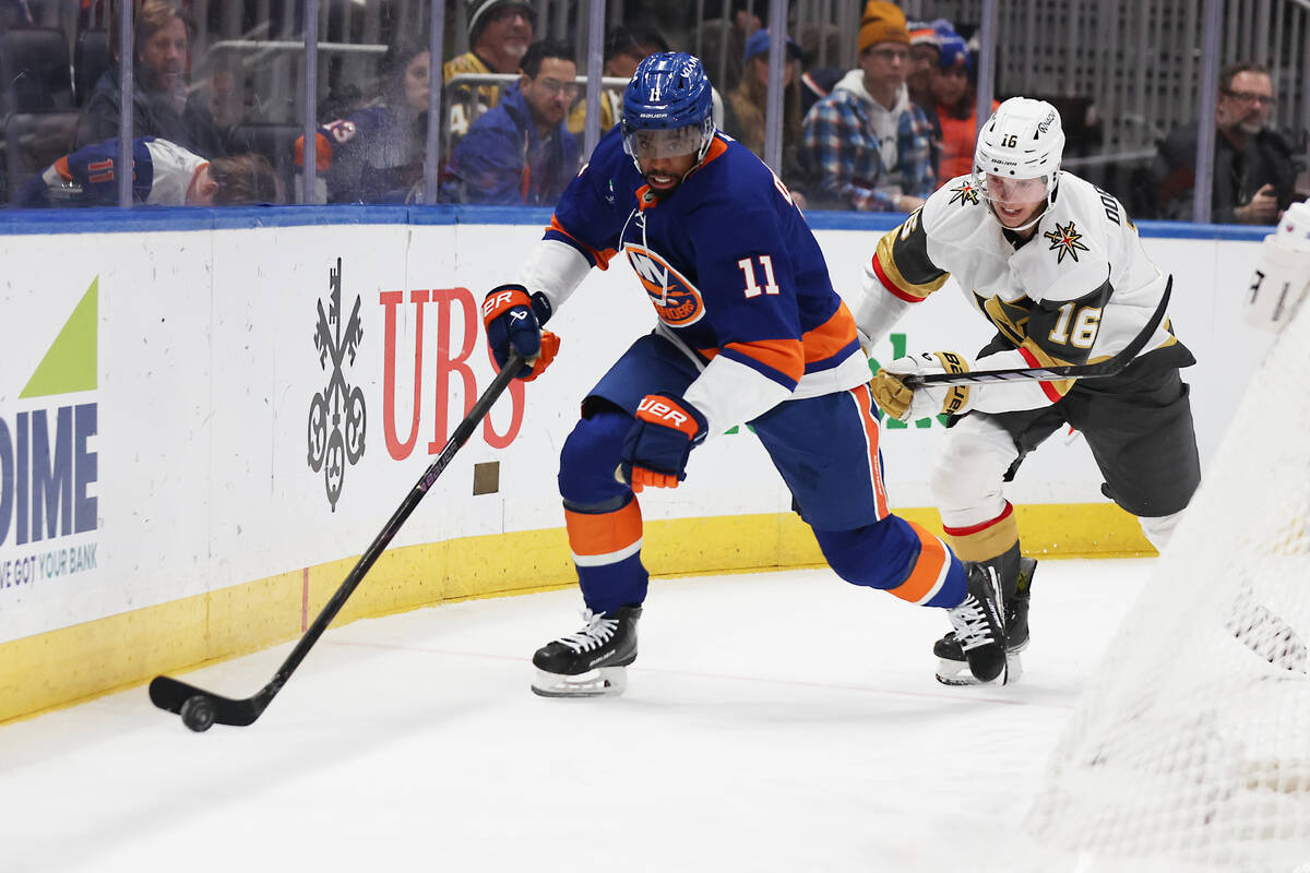 Vegas Golden Knights' Pavel Dorofeyev (16) chases down New York Islanders' Anthony Du ...