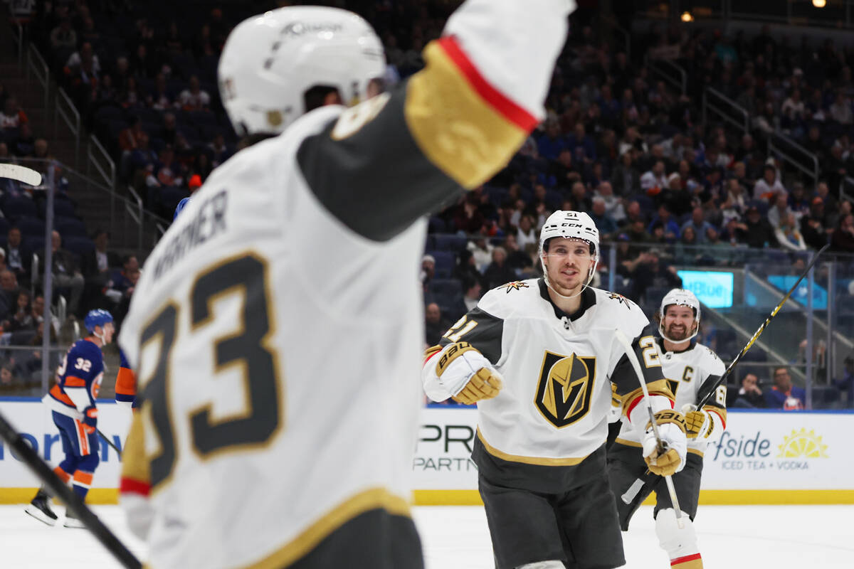 Vegas Golden Knights players celebrate a goal by Mitch Marner (93) during the first period of a ...