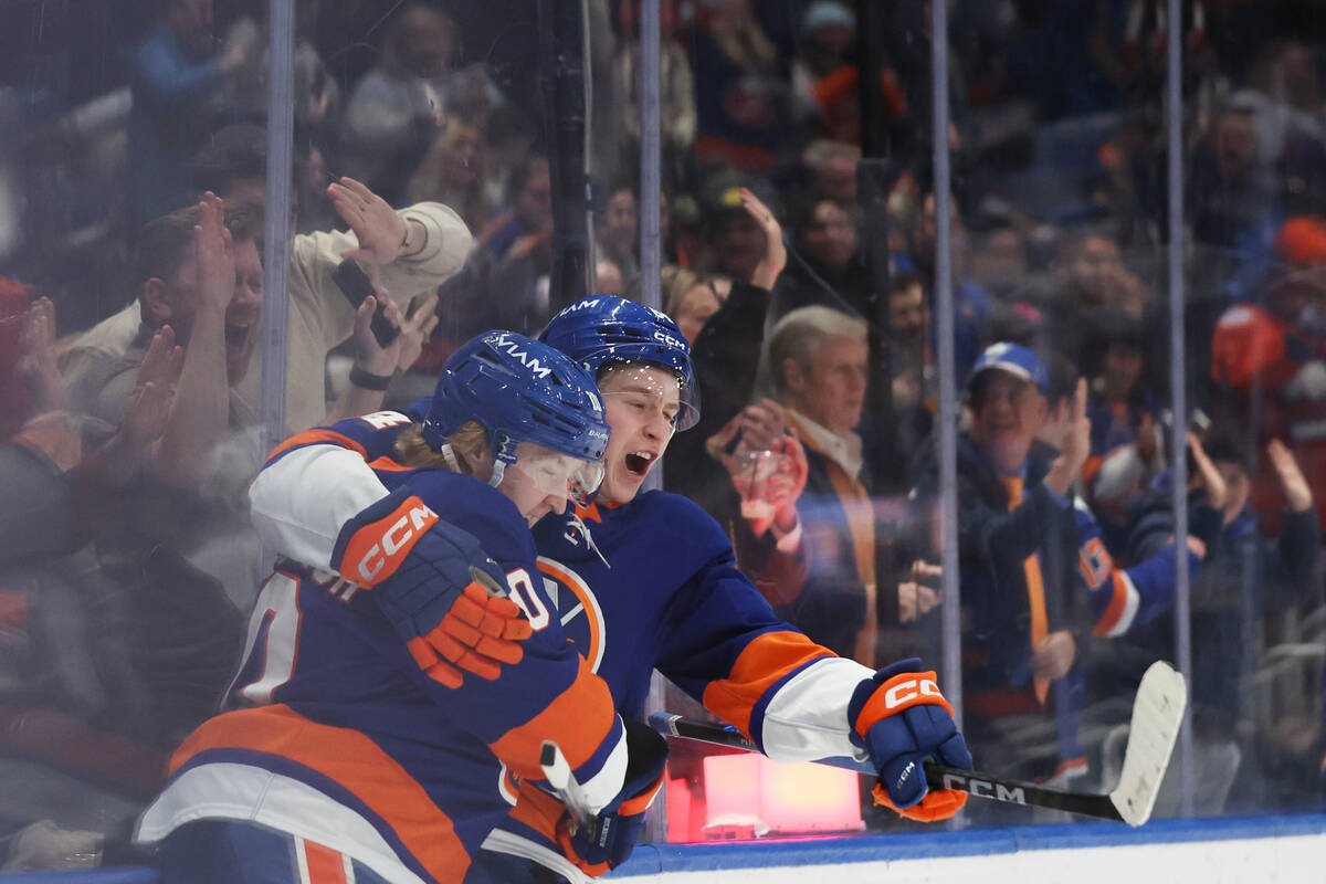 New York Islanders' Simon Holmstrom, left, celebrates his goal with teammate Calum Ritchie ...